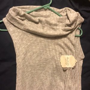 This is a sweater that is sleeveless.